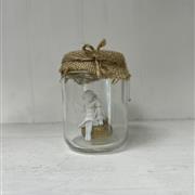 Angel Decoration In Jar On Stone